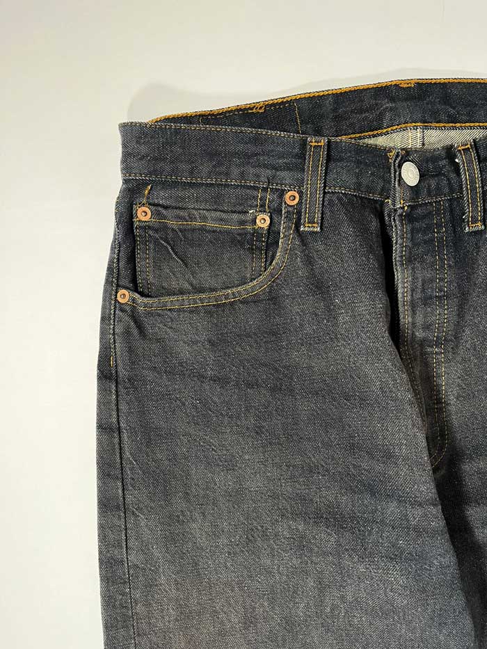 Jeans Levi's 501 vintage 90s raw, Placed on a neutral white background. Levi's vintage 501 raw from 1990s. Step into timeless style with this authentic vintage raw Levi's. Extreme quality fabric with unique color shades.
