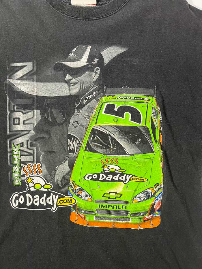 Black godaddy vintage t-shirt featuring Mark Martin, a very successful former racing driver. Considered one of the greatest drivers in NASCAR history. Positioned on a neutral white background.