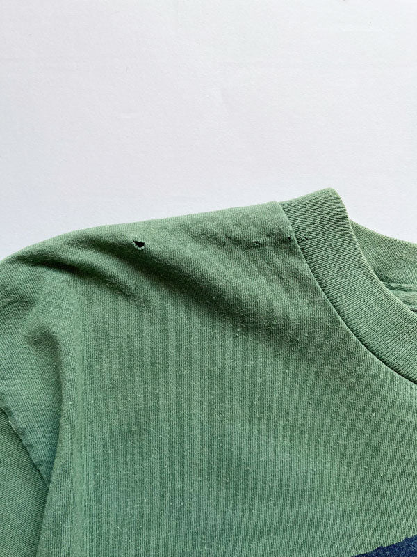 "God bless the whole world" single stitch t shirt vintage 90s. Made USA. Hanes brand. Print on the front with quote. Tee with green quality cotton. Size Large.