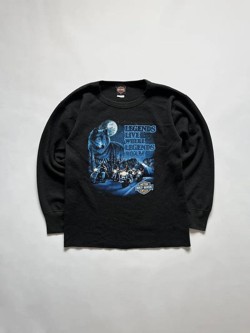 Vintage 90s Harley Davidson long sleeve tee model with "Legends Live Where Legends Roam" graphic. The front features a suggestive night scene. Made in USA.