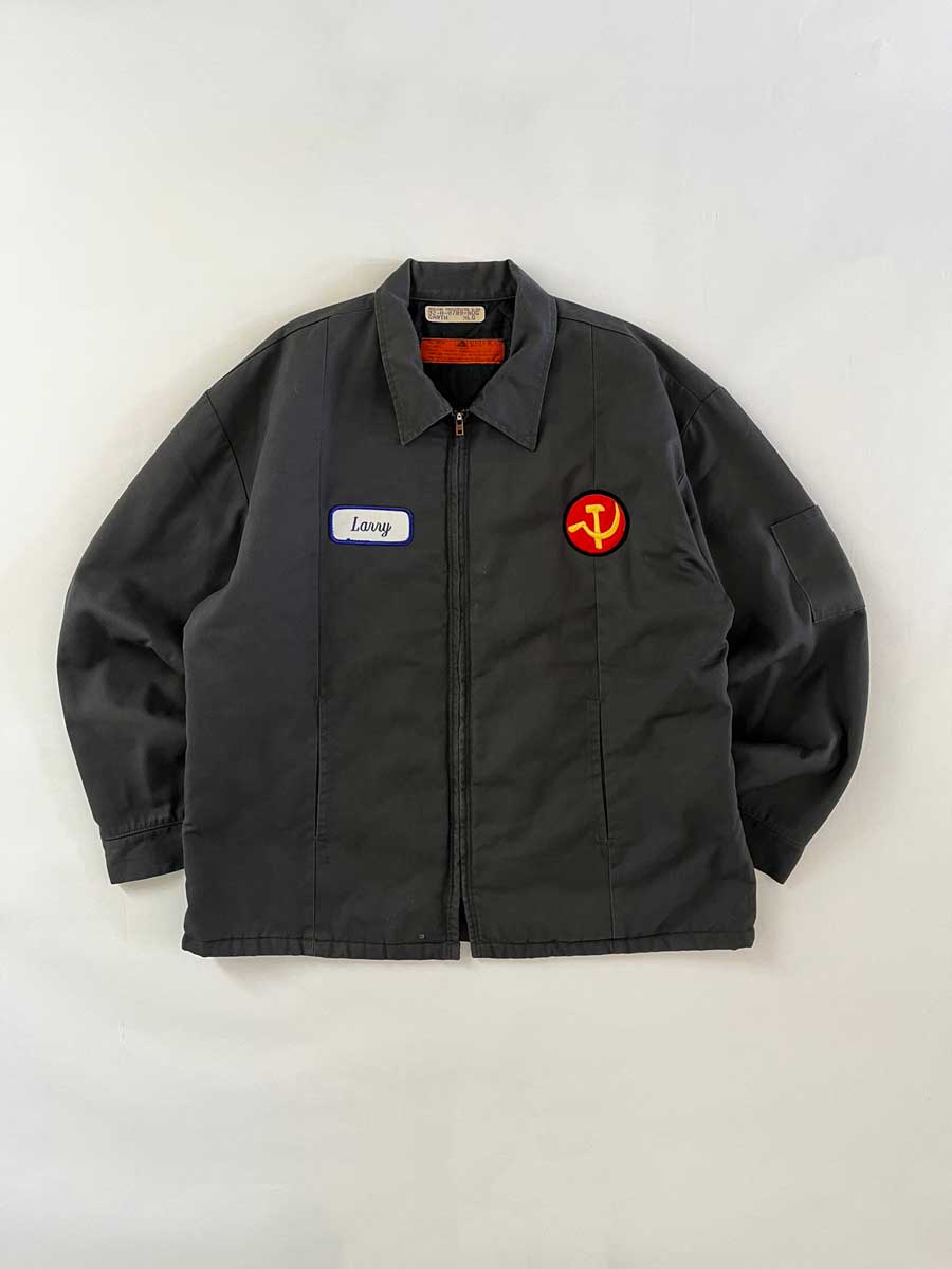 Red kap jacket produced in the 1990s by Red Kap. Quality fabric and perfectly maintained over time. Talon zip and double patch applied on the front. Positioned on a neutral white background.