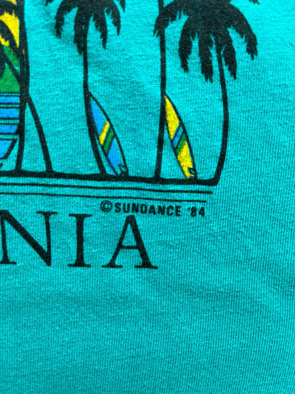 Single Stitch tee vintage produced in the United States in the 80s by Hanes. Print on the front depicting Redondo Beach California. Rare single stitch tee.