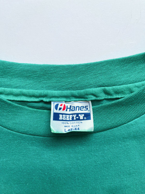 Single Stitch tee vintage produced in the United States in the 80s by Hanes. Print on the front depicting Redondo Beach California. Rare single stitch tee.