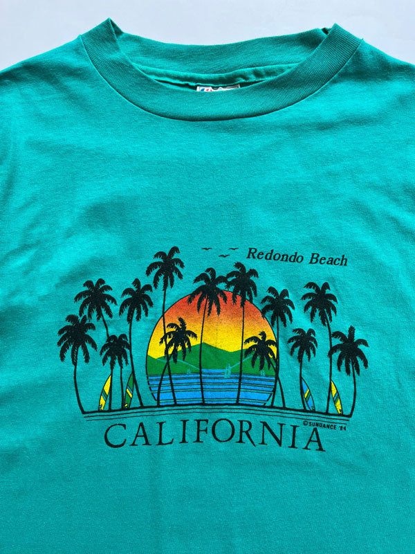 Single Stitch tee vintage produced in the United States in the 80s by Hanes. Print on the front depicting Redondo Beach California. Rare single stitch tee.