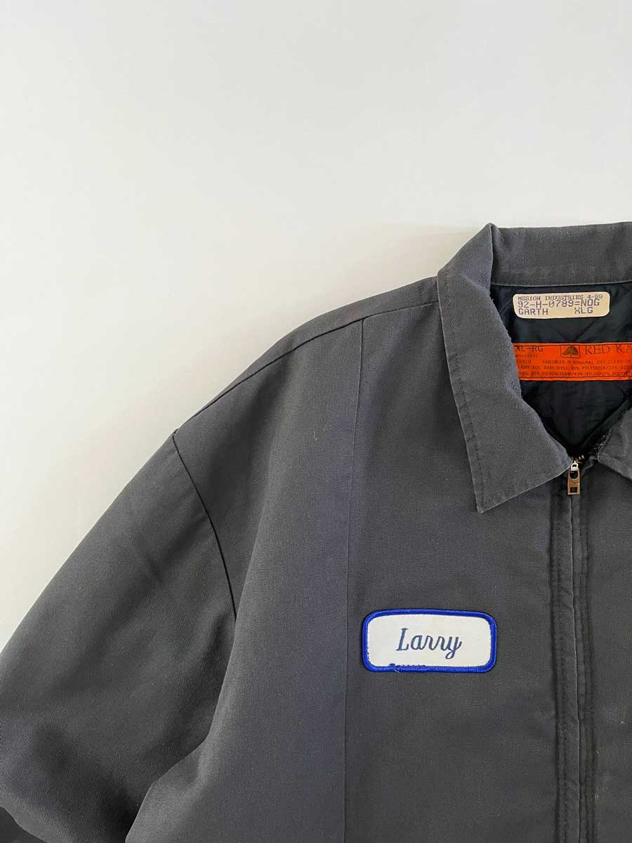 Red kap jacket produced in the 1990s by Red Kap. Quality fabric and perfectly maintained over time. Talon zip and double patch applied on the front. Positioned on a neutral white background.