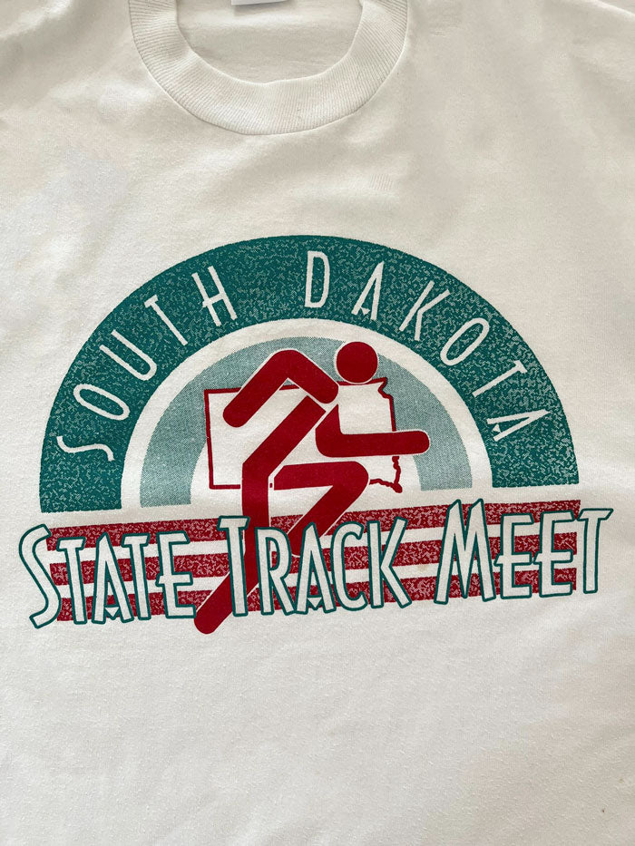 Vintage single stitch tee State Track meet South Dakota. 90s production, Jerzees brand by Russel Made USA. Recommended size L. In excellent condition. Rare.