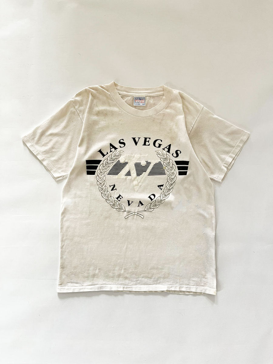 90s Las Vegas Nevada single stitch tee. Made in the United States in the 90s. Print on the front with "Nevada" writing. Brand "All Sports Made in Mexico".