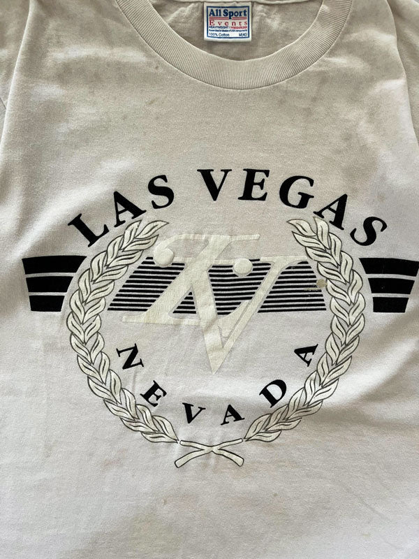 90s Las Vegas Nevada single stitch tee. Made in the United States in the 90s. Print on the front with "Nevada" writing. Brand "All Sports Made in Mexico".