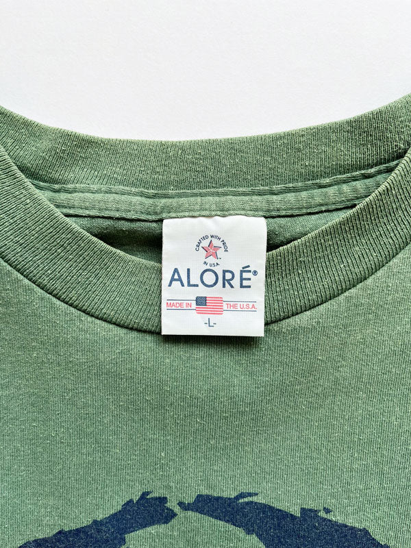 "God bless the whole world" single stitch t shirt vintage 90s. Made USA. Hanes brand. Print on the front with quote. Tee with green quality cotton. Size Large.