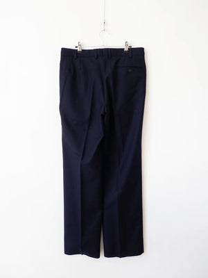 Pantaloni Marina Militare Italiana blu navy in lana, vista posteriore su gruccia