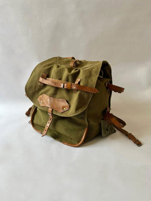 Vintage army backpack used by the Romanian army from the 1970s to the 1980s. This military canvas bag is constructed of leather and with unique details.