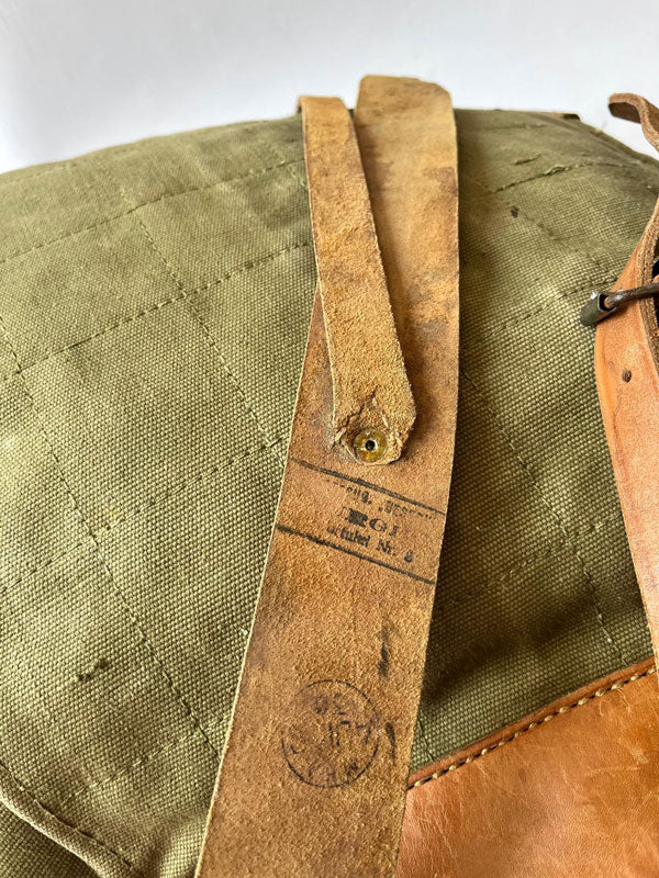 Vintage army backpack used by the Romanian army from the 1970s to the 1980s. This military canvas bag is constructed of leather and with unique details.