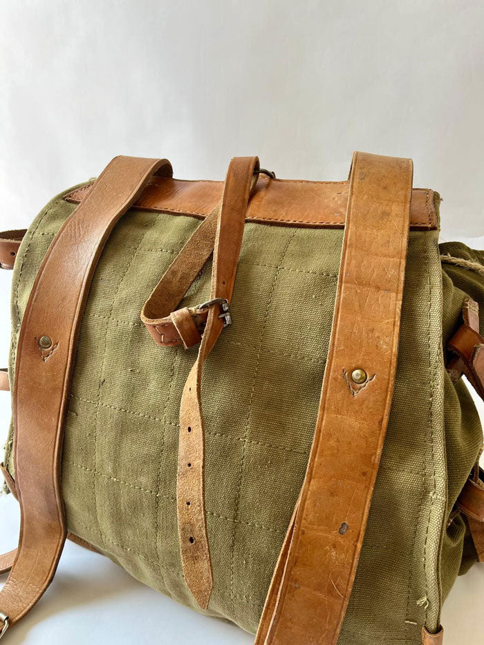 Vintage army backpack used by the Romanian army from the 1970s to the 1980s. This military canvas bag is constructed of leather and with unique details.