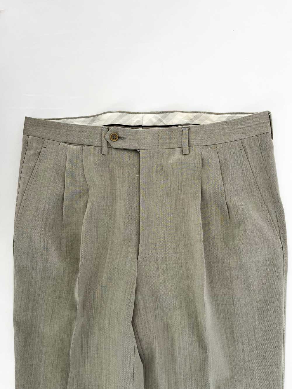 Vintage pleated artisan trousers, Milan channels. Placed on a neutral white background