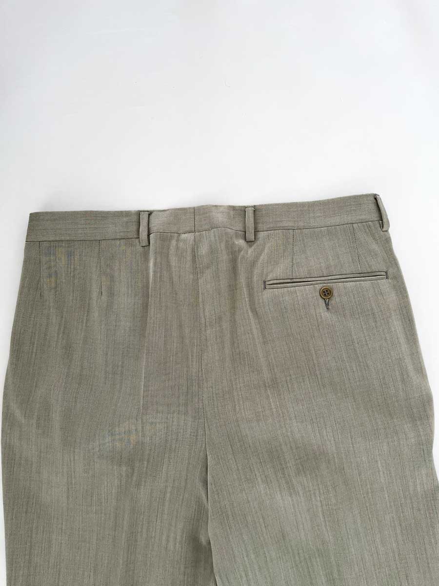 Vintage pleated artisan trousers, Milan channels. Placed on a neutral white background