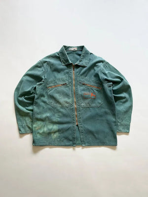 French cyclist jacket La Cigogne dated 60s/70s. Made in classic blue work cotton. The front closure is entrusted to an original ECLAIR zip. Size Medium.