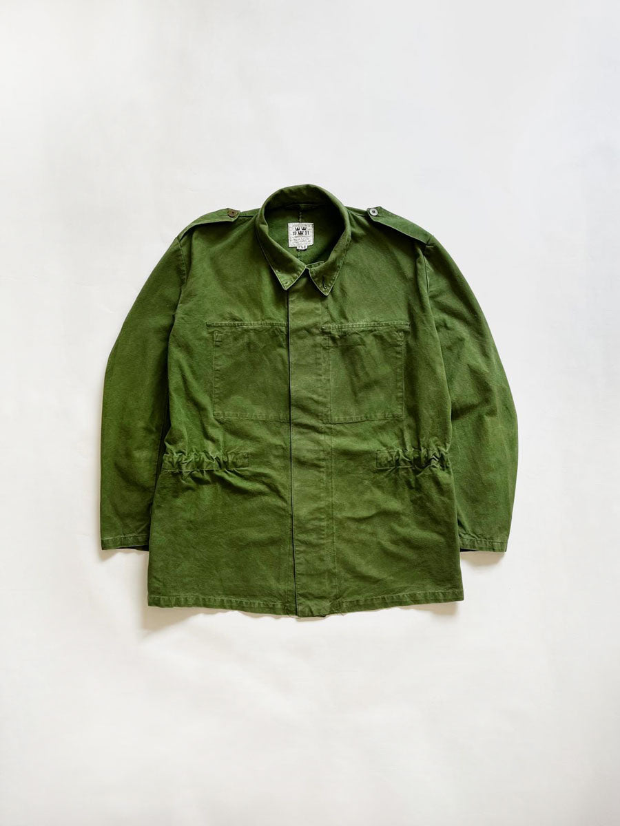 Vintage Swedish Army Uniform jacket M48. Jacket used by the Swedish army "svenska armén" dating back to the 70s and 90s. Made of cotton and bottle green color.