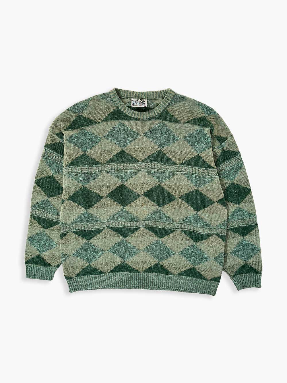 Green vintage sweater from the 90s. Wool fabric. Placed on a neutral white background.