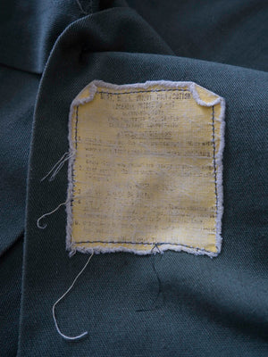 Detail of the original yellow durable press care label inside the OG-507 shirt.