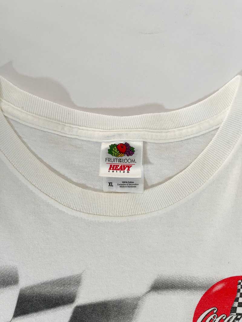 Vintage t-shirt fruit of the loom white by nascar and sponsor coca-cola. Positioned on a neutral white background.