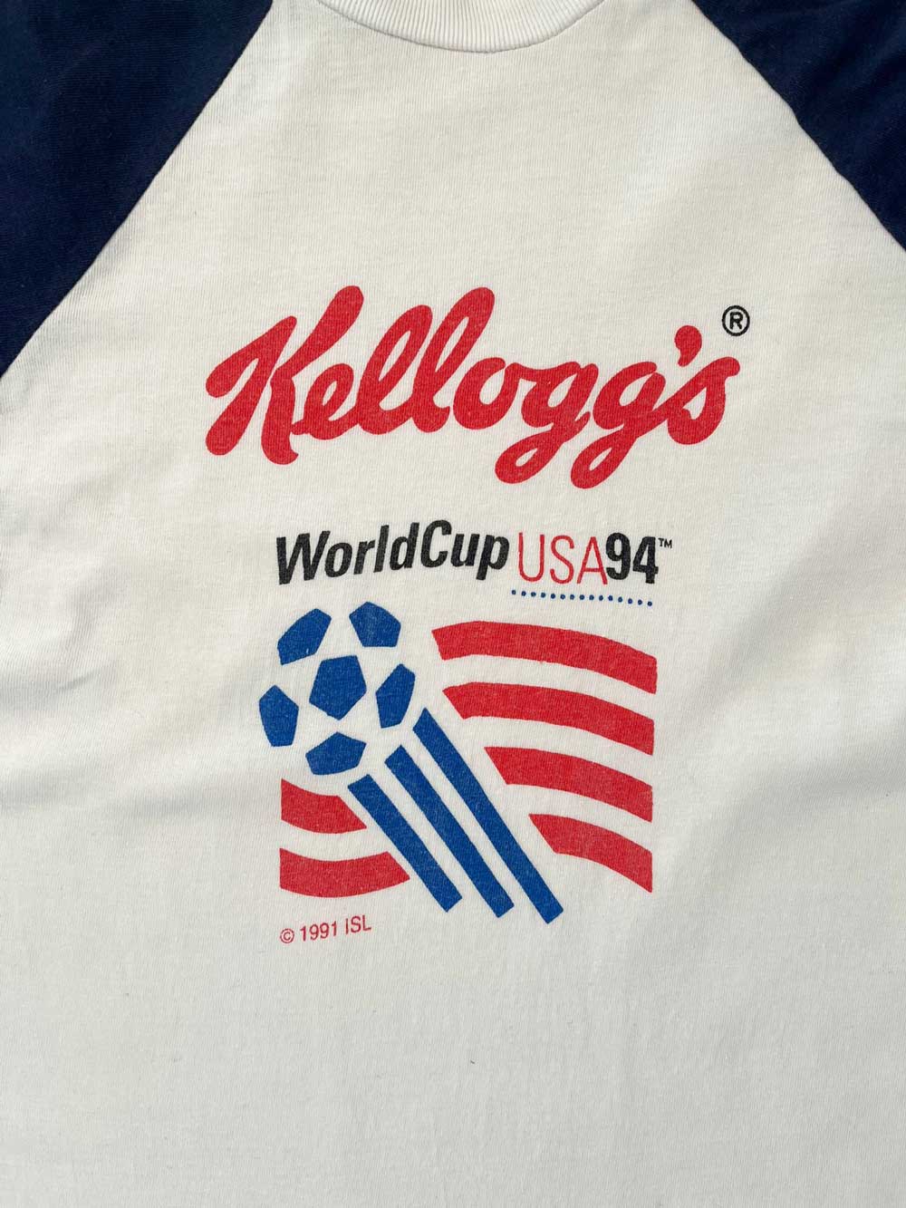 Vintage t-shirt created by Kellogg's for the USA94 World Cup. Kellogg's created, as did other major companies, shirts for the 1994 USA FIFA World Cup. Positioned on a neutral white background.