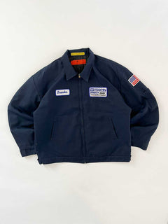 Vintage work jacket produced in the 1980s by Red Kap. Quality fabric and perfectly maintained over time. Talon zip and double patch applied on the front. Positioned on a neutral white background.