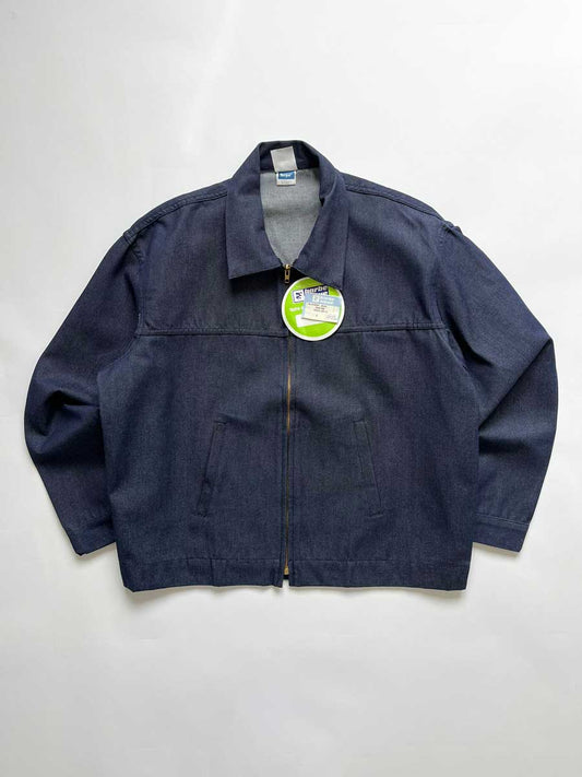 French vintage deadstock work jacket. Blue denim fabric. Placed on a neutral white background.