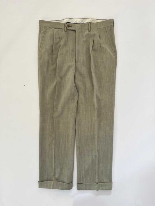Vintage pleated artisan trousers, Milan channels. Placed on a neutral white background