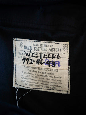 Etichetta originale Naval Clothing Factory, 100% lana, con nome e numero di servizio