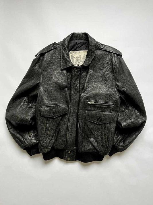Vintage leather jacket in real black leather, Expresso brand. Aviator style jacket. Placed on a neutral white background.