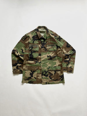 US Army jacket combat coat Vintage. Size M regular. US Army Warm Weather Woodland Camouflage Pattern Combat Coat, made of a tough and durable ripstop fabric. 