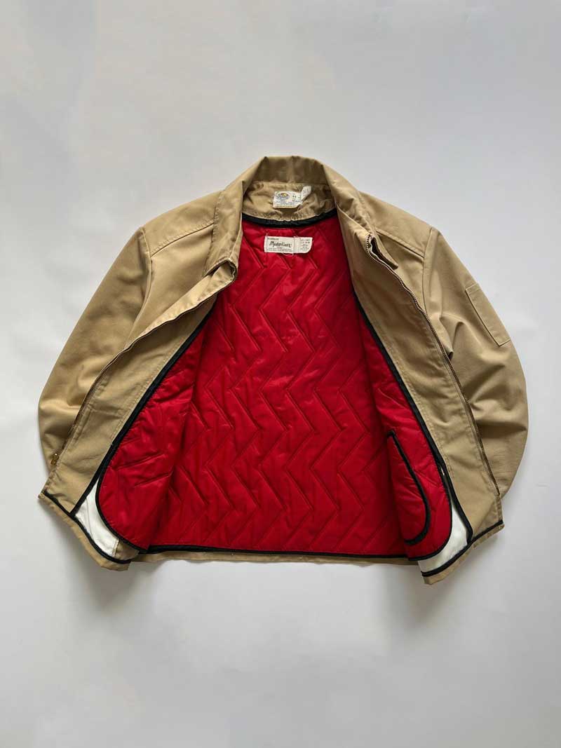 Vintage Work jacket from the 1960s Riverside. Jacket made in the USA with removable red inner liner. Talon zip and very small beautiful ideal zip internally. Positioned on a neutral white background.