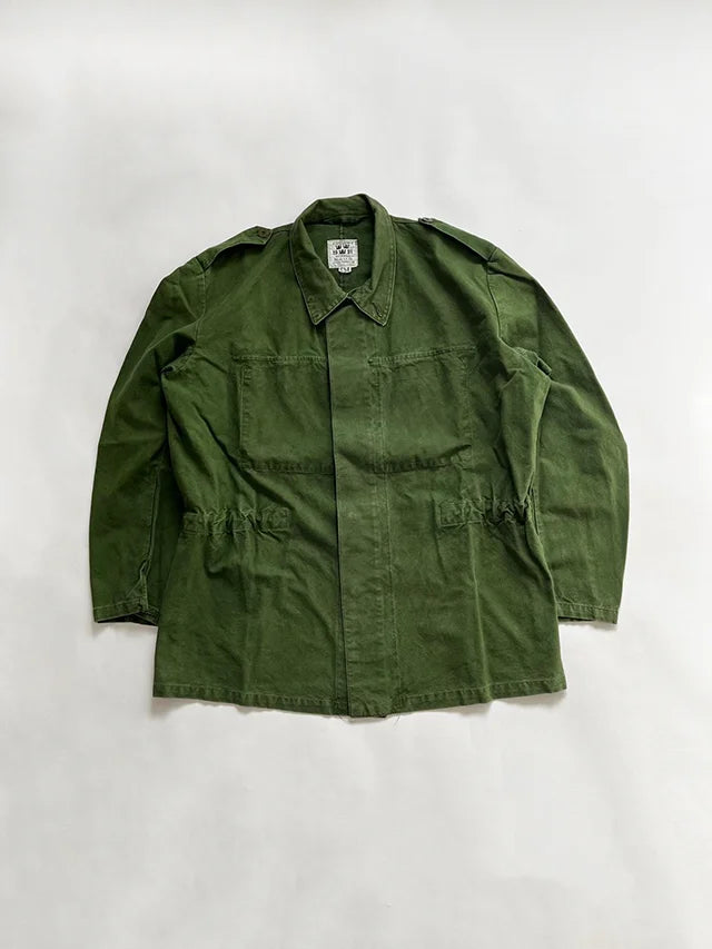 Vintage Swedish Army Uniform jacket M48. Jacket used by the Swedish army "svenska armén" dating back to the 70s and 90s. Made of cotton and bottle green color.