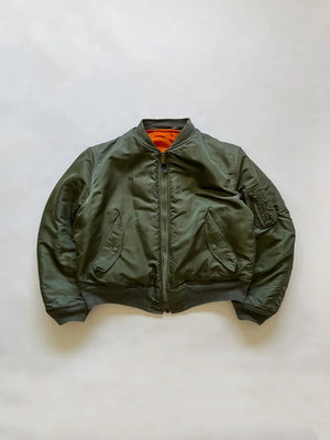 Vintage Authentic US Air Force 1970's MA-1 bomber jacket, produced by Alpha Industries in 1973, with safety orange lining and fully reversible. Zip Scovill.