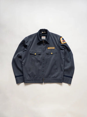 1970s Vintage USPS Letter Carrier Jacket. The color is a blue-gray. Made in USA, produced by United States Uniform Co. Boxy fit. United States Postal Service.