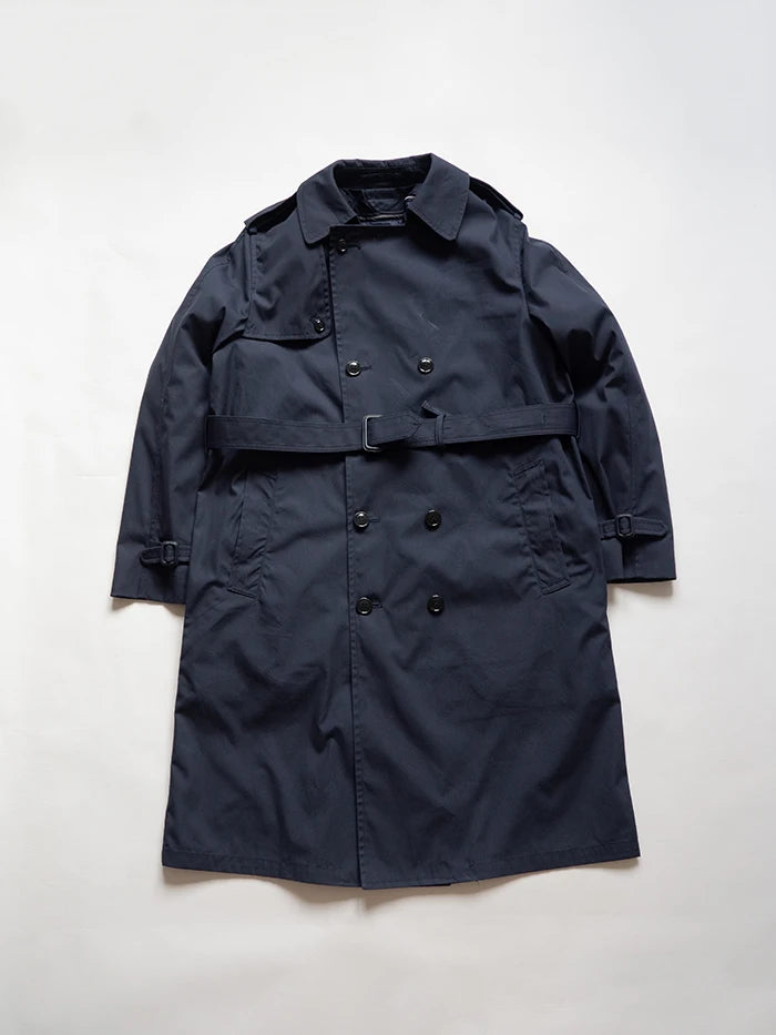 Classic trench coat used by the US Air Force. Navy blue. Double-button construction, belt, and removable inner liner. Perfect for any season. Size Large.