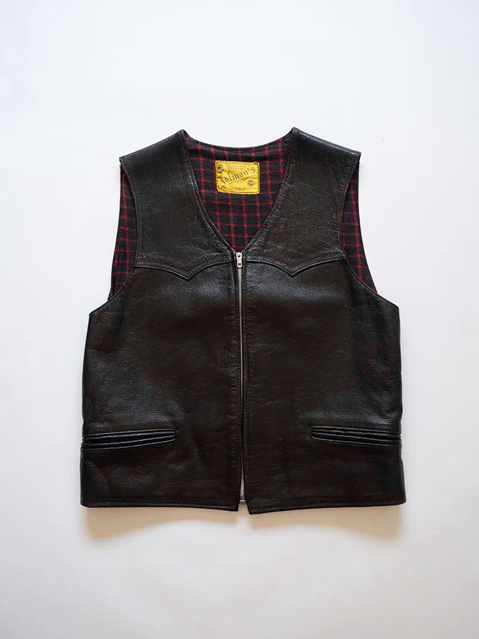 Genuine black leather vest, made in Italy, dating back to the 1970s. The leather has a soft texture, and the interior features a plaid wool flannel lining.
