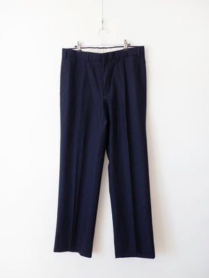 Pantaloni Marina Militare Italiana blu navy in lana, vista frontale su gruccia