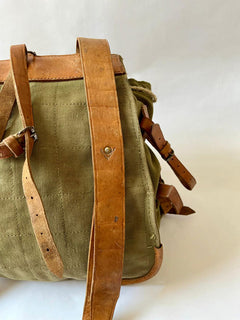 Vintage army backpack used by the Romanian army from the 1970s to the 1980s. This military canvas bag is constructed of leather and with unique details. 