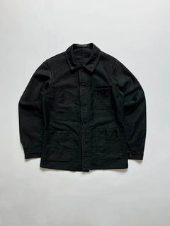 40s Vintage french work jacket in black moleskin by Tigra. Wide round collar, trapeze silhouette, V-shaped pockets and embroidered label. Size Small.