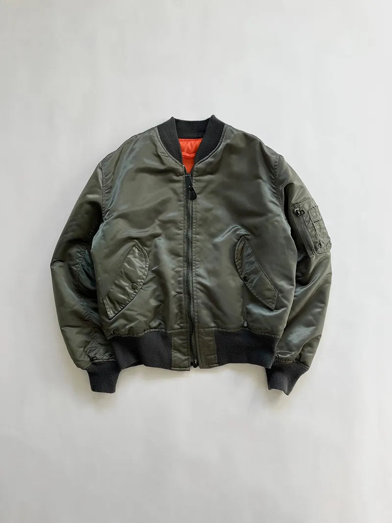 Vintage MA1 Bomber Jacket 80s. Size Medium/Large. Made in USA. Corinth MFG. A true vintage piece of American military history. Reversible orange interior.