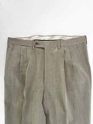 Vintage pleated artisan trousers, Milan channels. Placed on a neutral white background