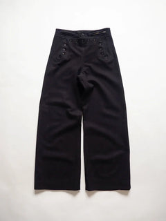 U.S. Navy cracker jack pants from the 1940s, dating back to the WWII era. They are the traditional sailor's trousers with bell bottoms and a 13-button.