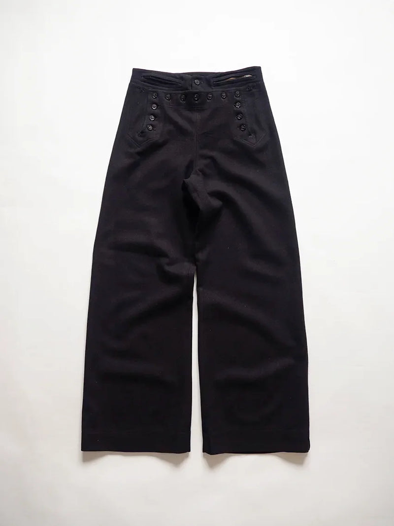 U.S. Navy cracker jack pants from the 1940s, dating back to the WWII era. They are the traditional sailor's trousers with bell bottoms and a 13-button.