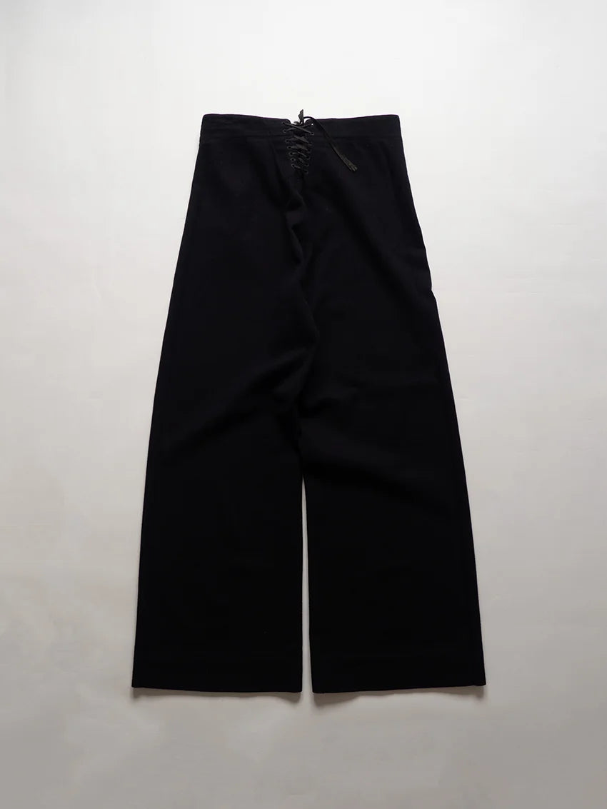 U.S. Navy cracker jack pants from the 1940s, dating back to the WWII era. They are the traditional sailor's trousers with bell bottoms and a 13-button.