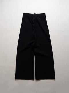 U.S. Navy cracker jack pants from the 1940s, dating back to the WWII era. They are the traditional sailor's trousers with bell bottoms and a 13-button.