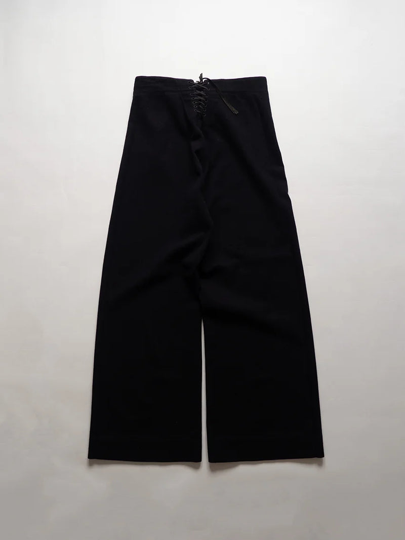 U.S. Navy cracker jack pants from the 1940s, dating back to the WWII era. They are the traditional sailor's trousers with bell bottoms and a 13-button.