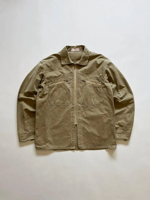 French cyclist jacket La Cigogne dated 60s/70s. Made in beige work cotton. The front closure is entrusted to an original ECLAIR zip. Size Large.