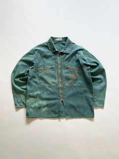 French cyclist jacket La Cigogne dated 60s/70s. Made in classic blue work cotton. The front closure is entrusted to an original ECLAIR zip. Size Medium.