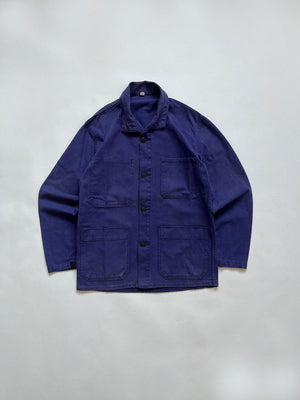 French chore jacket vintage from 80s. Size Medium. Crafted from high-quality, durable cotton. The various shades of blue give this jacket a unique character.